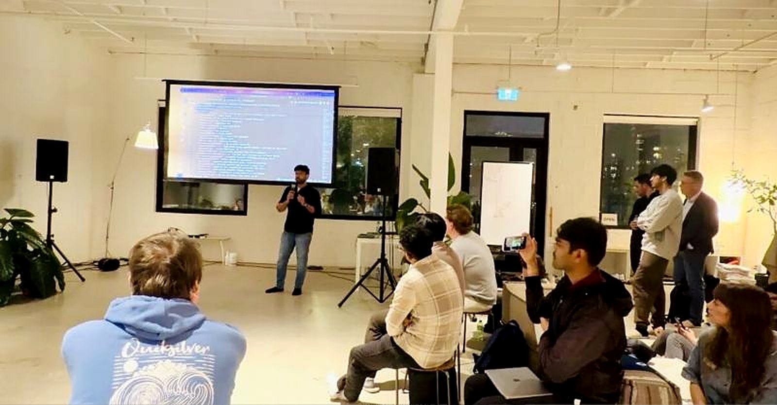 Vimal presenting live code to a room of developers